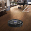 Black Pursonic i7 Pro robotic vacuum cleaner on wooden floor