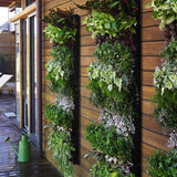 Vertical Garden Planter hanged in the wall with plants